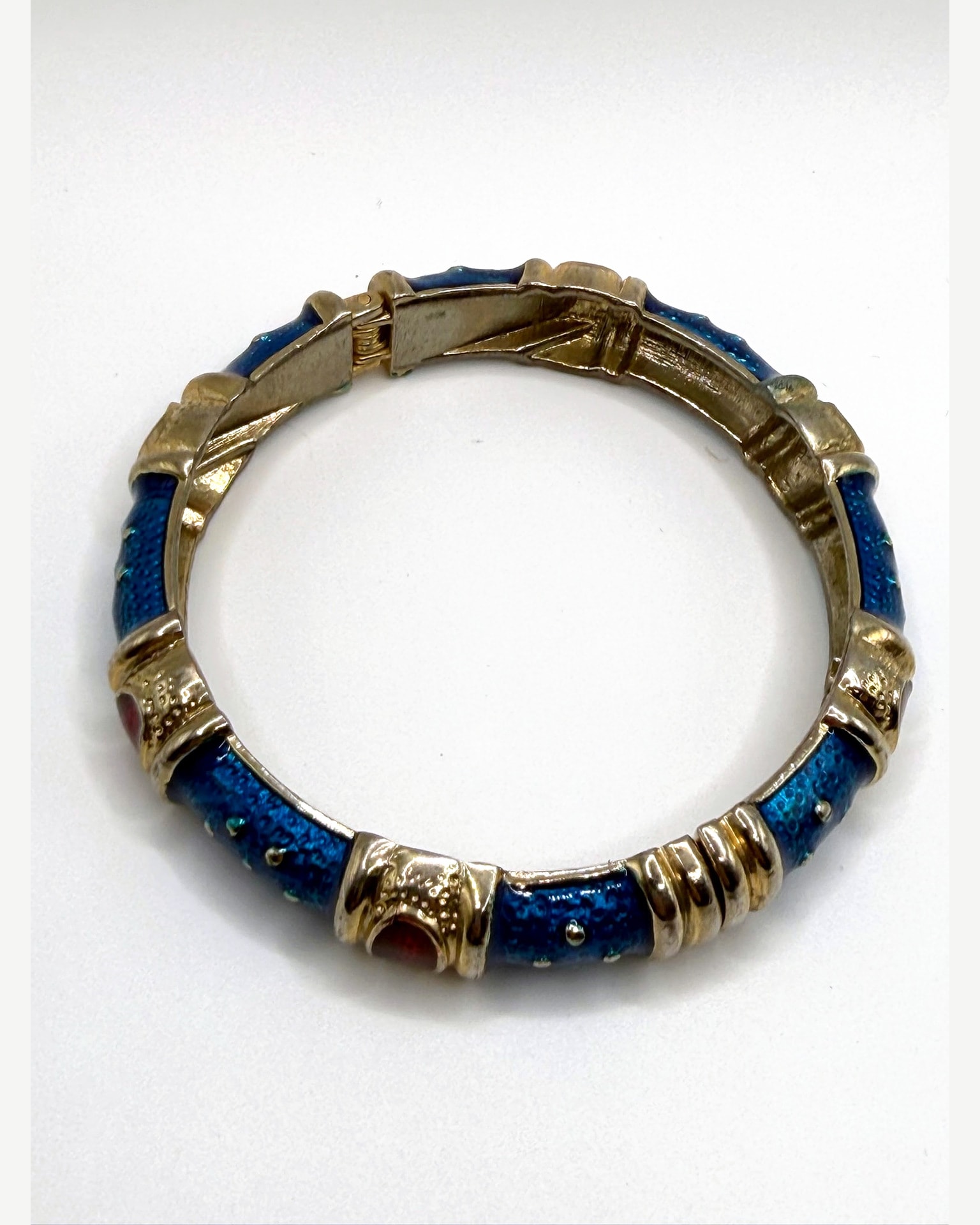 Gold-Tone Blue Enamel Hinged Bangle Bracelet with Red Cabochon Accents