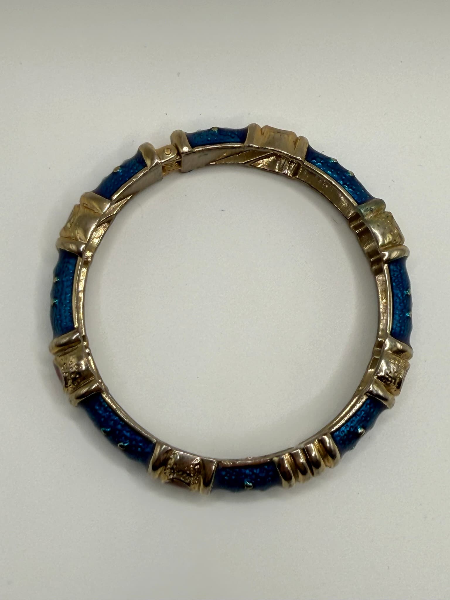 Gold-Tone Hinged Bangle Bracelet with Blue Textured Inlay