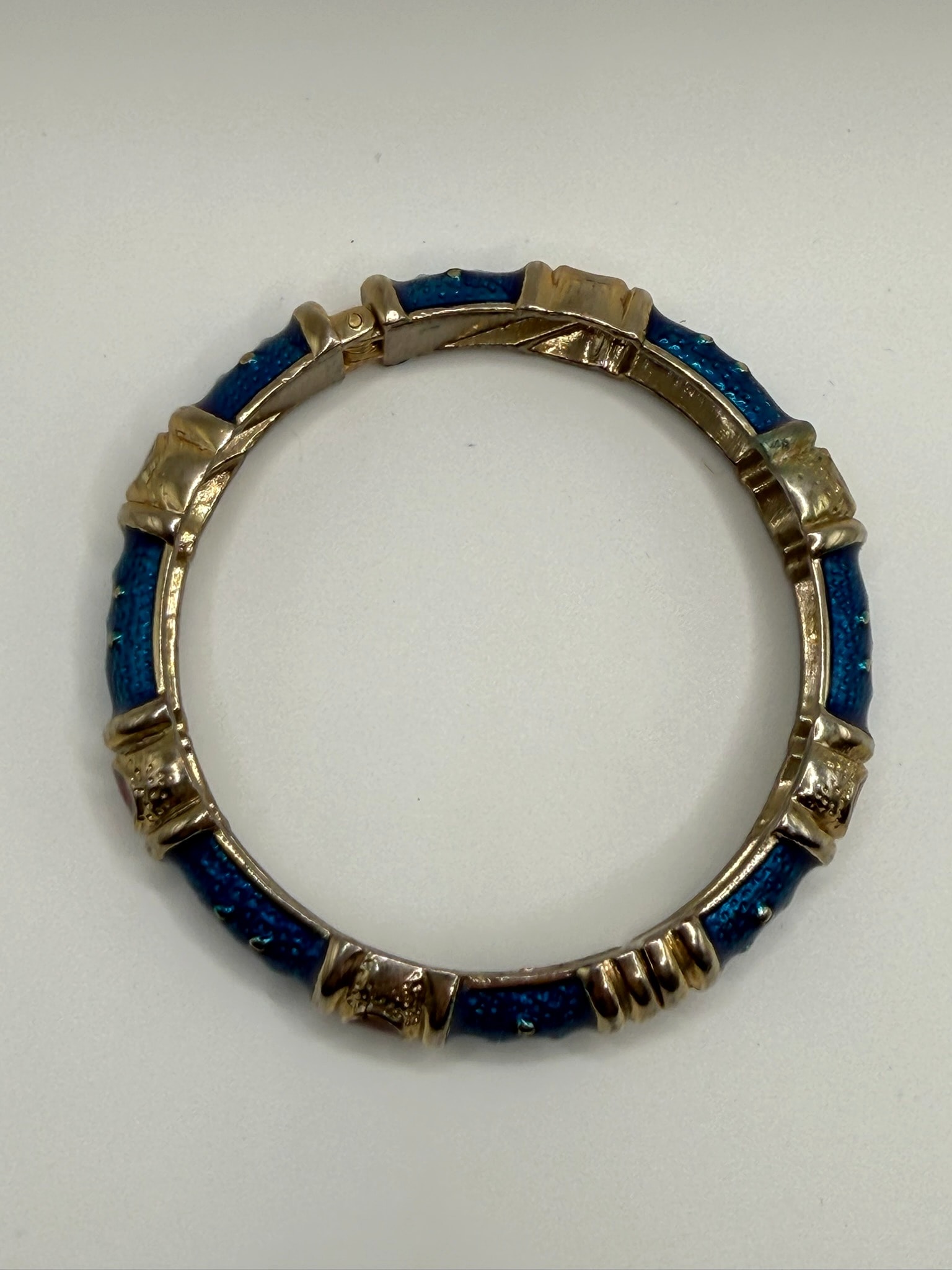 Gold-Tone Hinged Bangle Bracelet with Blue Textured Inlay