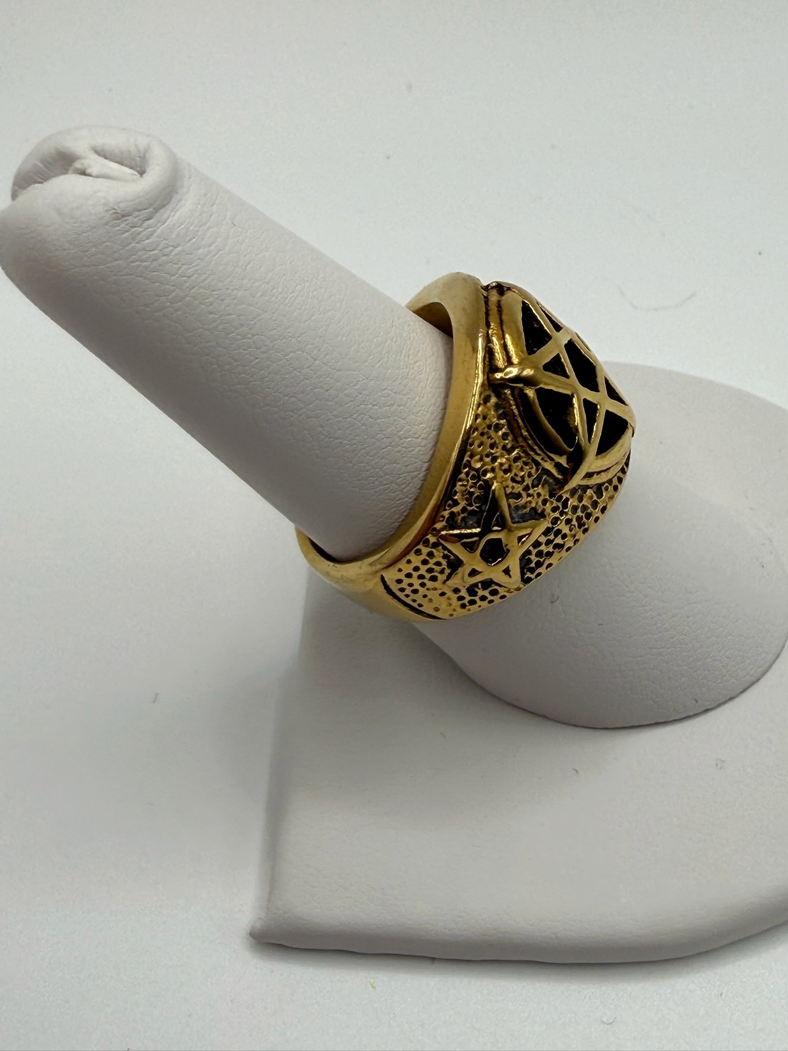 Gold-Tone Wide Band Ring with Black Openwork and Star Motif